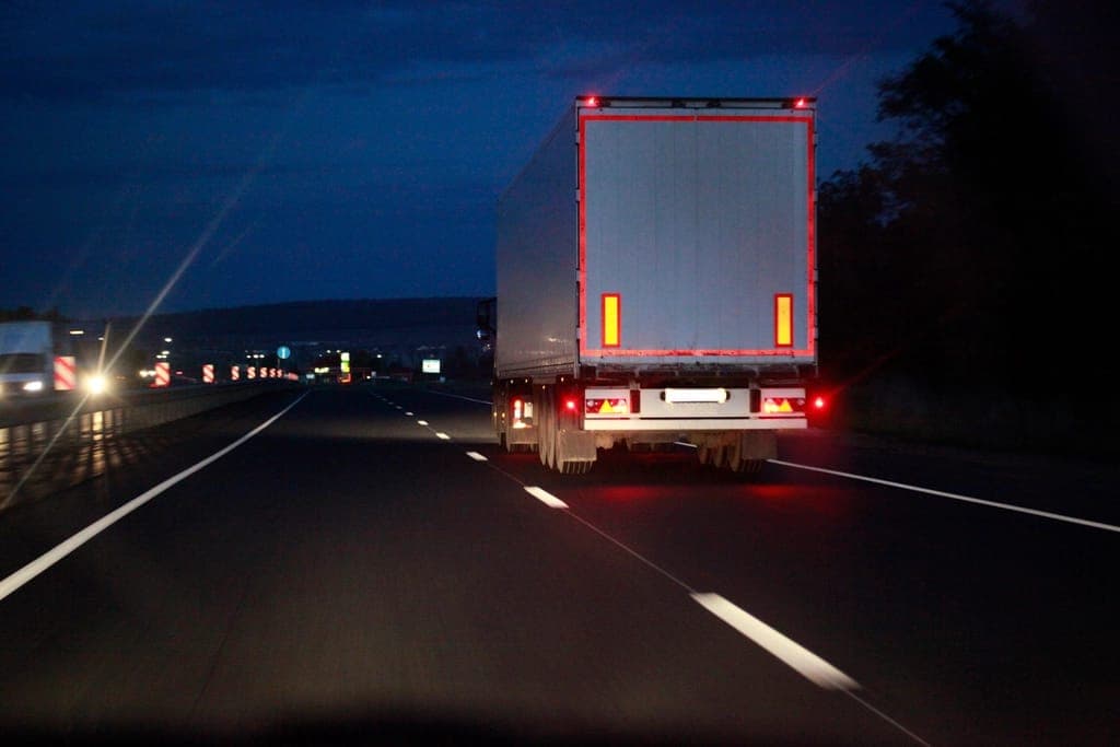 Refrigerated truck on a highway at night